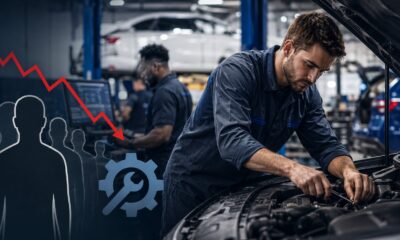 automotive technician working on complex vehicle as dealerships face growing skilled worker shortage